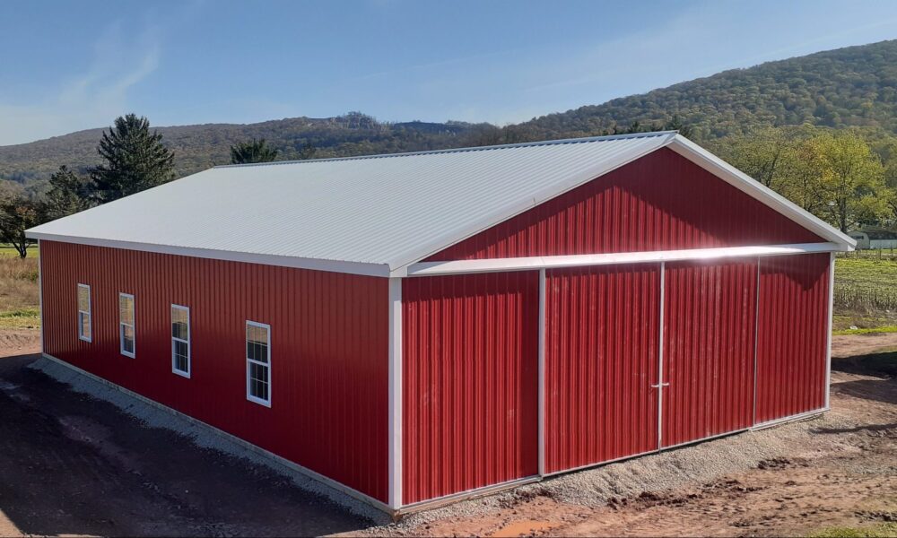 Red and white horse pole barn