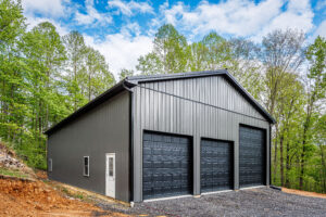 IMG_7043-HDR pole barn with gray siding and black garage doors