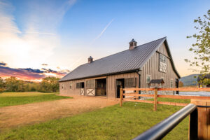 Jake Stoltsfuz_SBR53954-HDR-Edit back view of horse barn leading to large yard