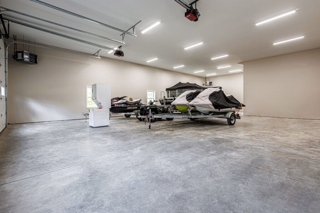 pole barn open interior with jet skis inside